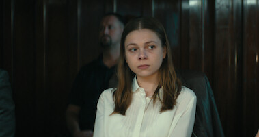 A woman in a white blouse