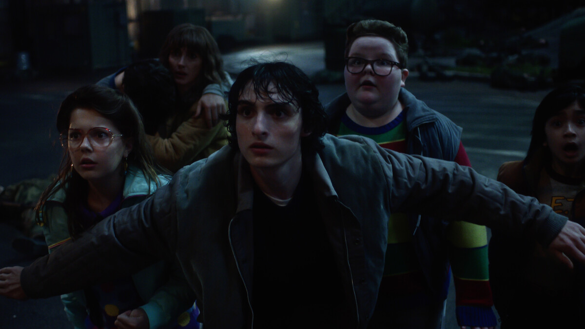 Winona Ryder as Joyce Byers, Finn Wolfhard as Mike Wheeler and Jake Connelly as Derek in 'Stranger Things 5'
