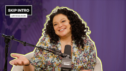 Michelle Buteau smiles and sits in front of a microphone, wearing a floral top. The background is purple, and there's a text box saying "SKIP INTRO with Krista Smith" in the top left corner.