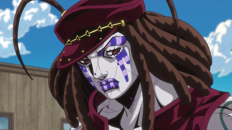Anime character with white skin, purple facial markings, and brown dreadlocks, wearing a red hat and clothing, is outdoors in front of a wooden building under a blue sky with clouds.