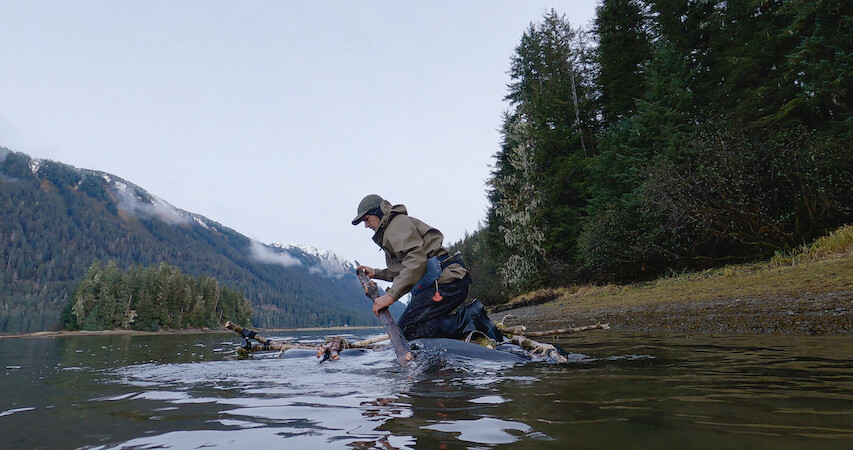 a man using a makeshift raft