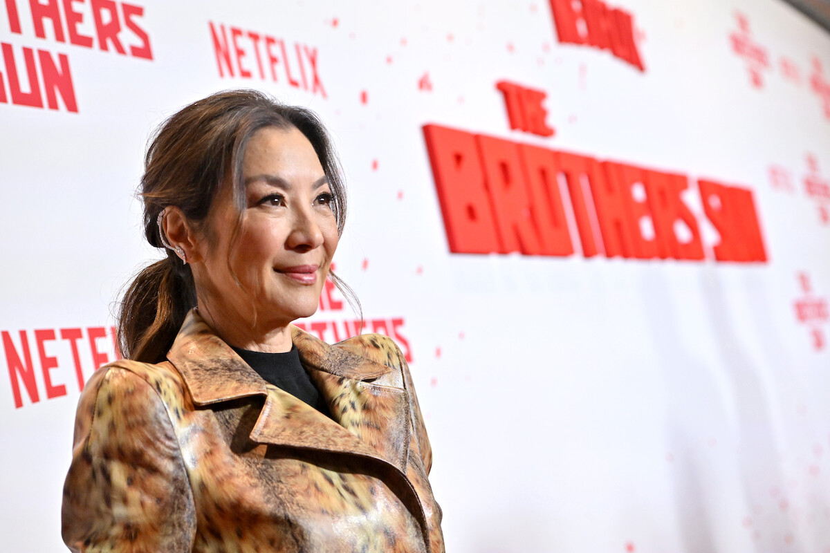 Michelle Yeoh attends Netflix's The Brothers Sun Los Angeles Premiere at Netflix Tudum Theater wearing a gold dress