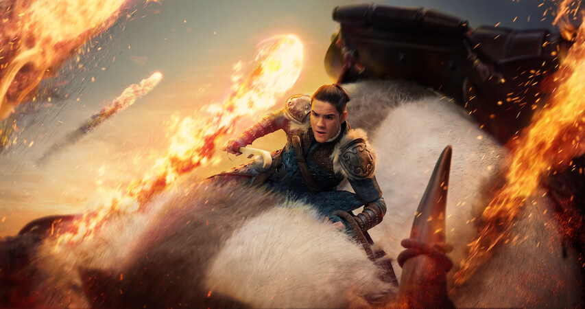 Ian Ousley as Sokka rides Appa through the air as fireballs soar by him in season 1 of 'Avatar: The Last Airbender'