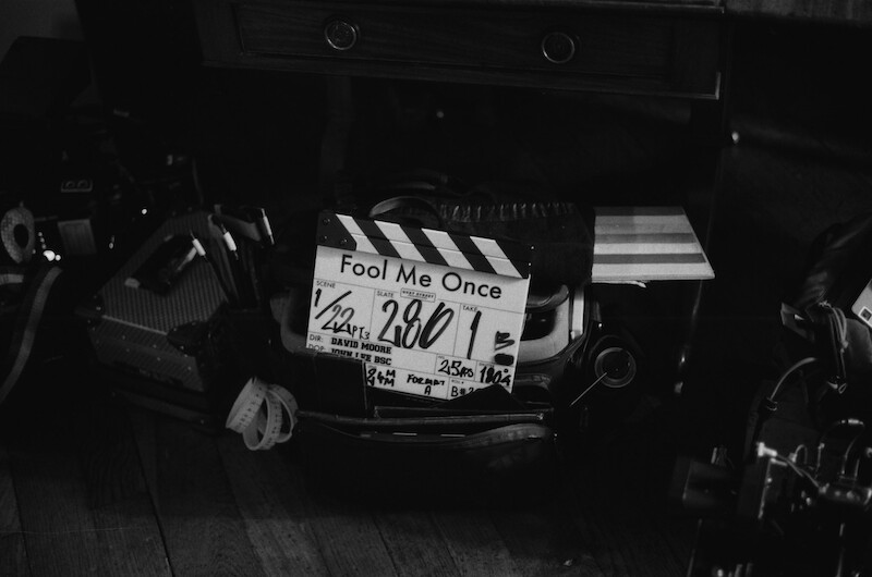 Black-and-white image of a clap board for season 1 of 'Fool Me Once'