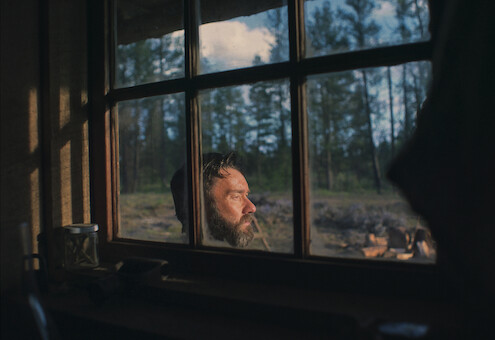 Joel Edgerton as Robert Grainier in Train Dreams.