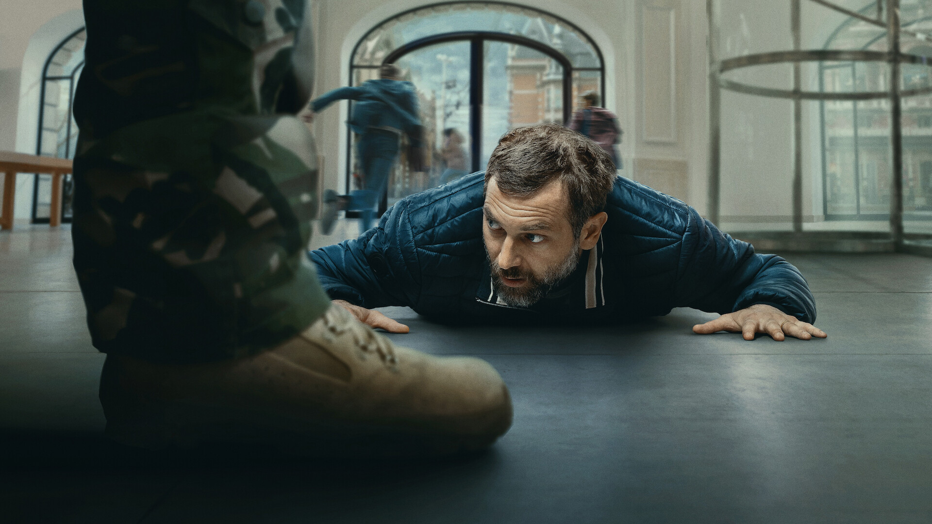 iHostage - a man laying on the floor of a bank. 