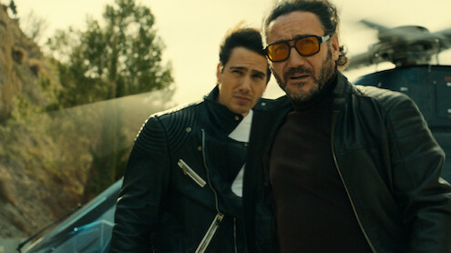 Carlos Santos as Rafa and Pau Simon as Max step off a helicopter in a production still from 'Billionaires' Bunker.'