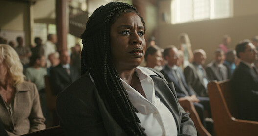 Uzo Aduba as Edie sits in a courtroom in Season 1 of 'Painkiller.'