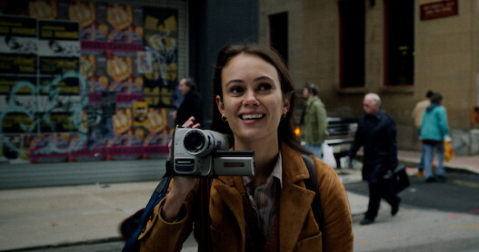 A close up of Melody with her handheld video recorder