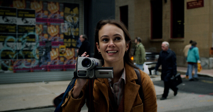 A close up of Melody with her handheld video recorder