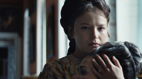 Devrim Lingnau as Elisabeth von Wittelsbach holds a woman's head to her chest in Season 2 of 'The Empress'