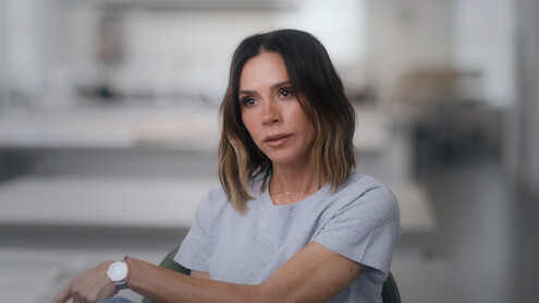 Victoria Beckham looks into the distance in deep contemplation.