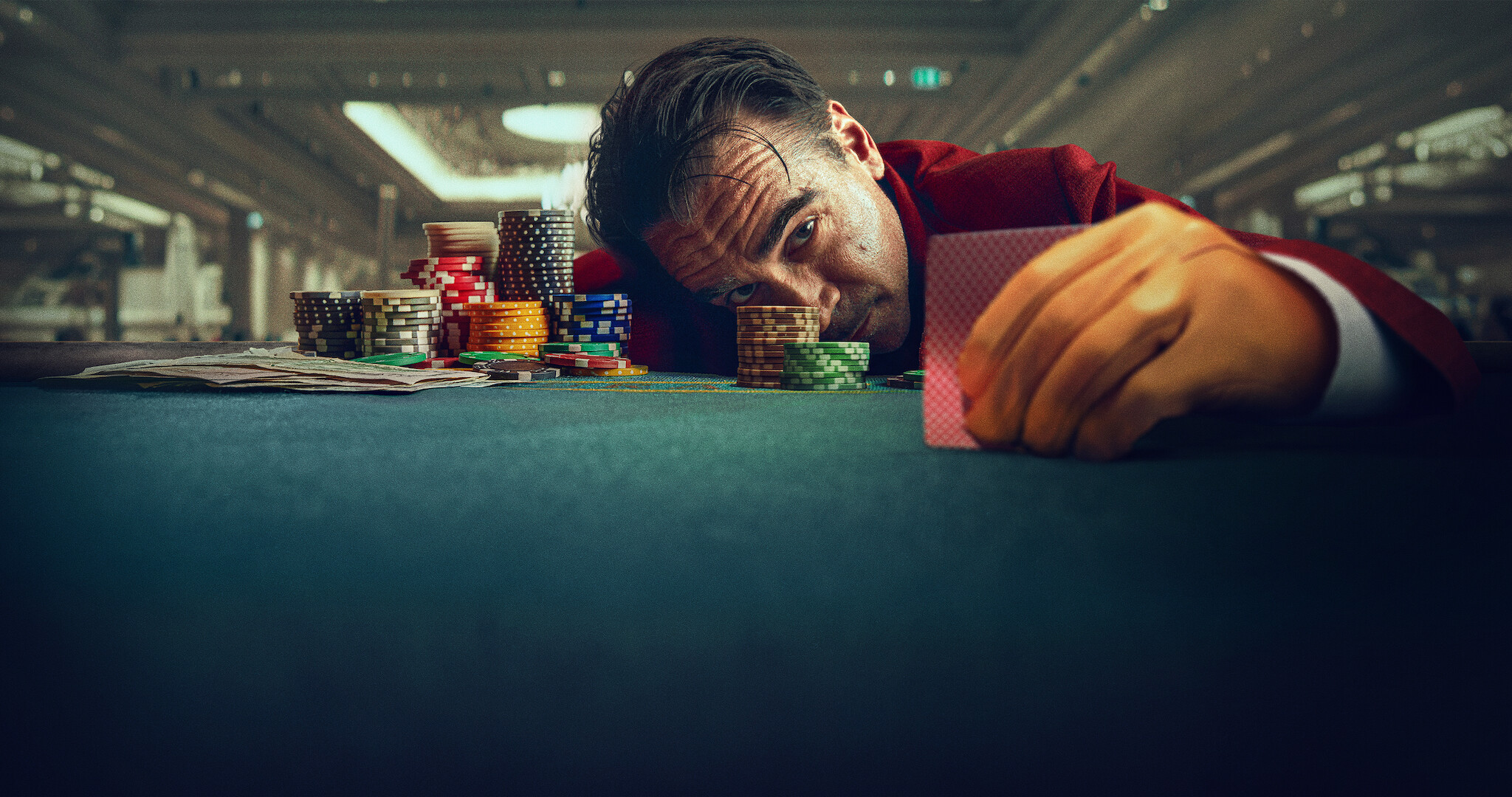 Ballad of a Small Player - Colin Ferrel sitting at a poker table