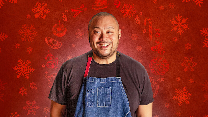 David Chang in a blue apron