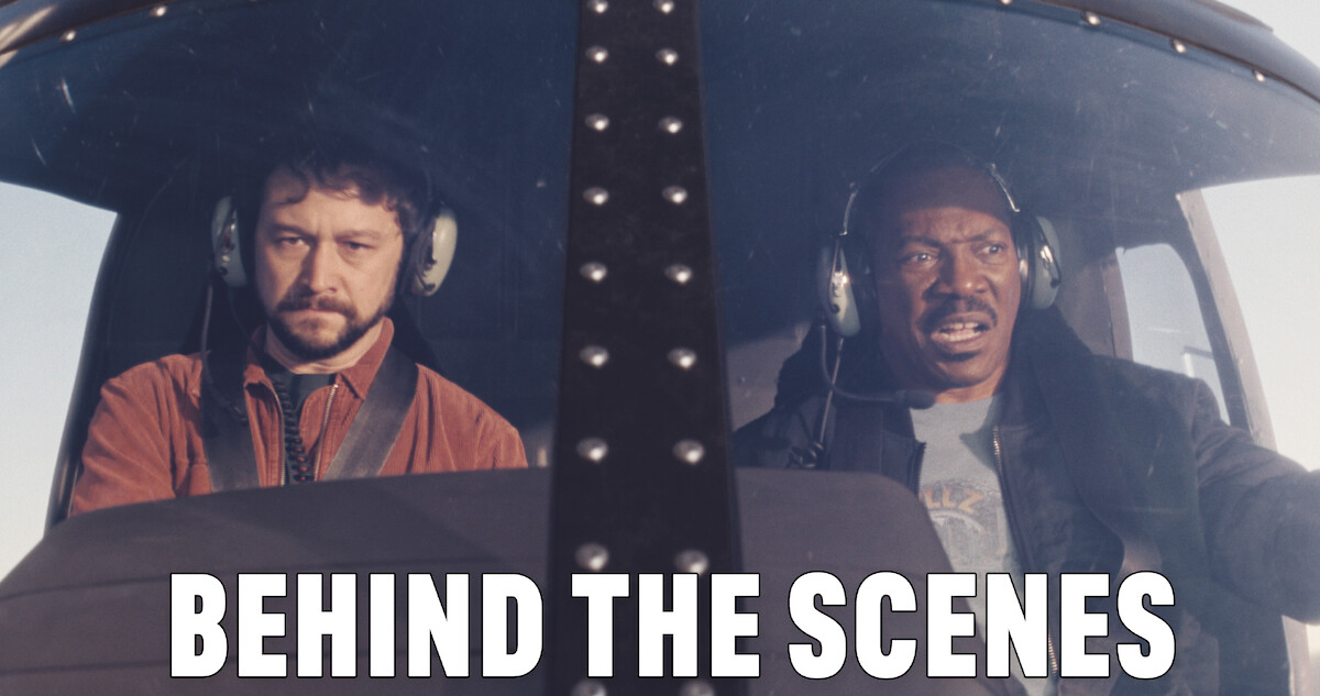 Detective Bobby Abbott (Joseph Gordon-Levitt) and Detective Axel Foley (Eddie Murphy) in the cockpit of a helicopter.