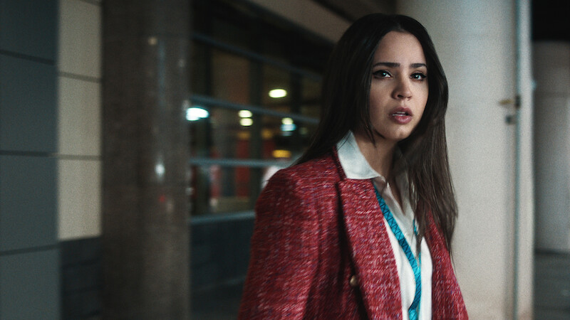 Sofia Carson in red blazer looking distressed.