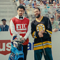 Quinn Stiller as Will Zalatoris Caddie, Benito Antonio Martínez Ocasio as Busboy, Adam Sandler as Happy Gilmore and Justin Thomas as himself in 'Happy Gilmore 2'