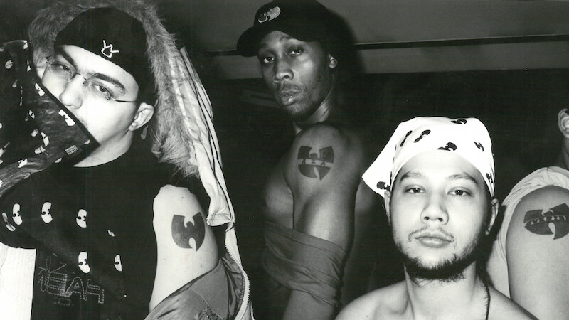A black and white photograph featuring (L to R) Tarik Azzougarh, The RZA and Jeremy Waterloo showing off their Wu-tang Clan tattoos as featured in The Disciple. Photo by Tarik Azzougarh