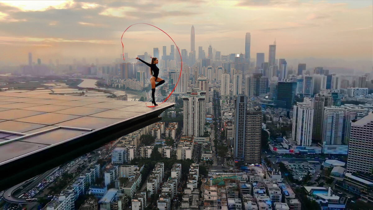 Angela Nikolau performing on top of a building.