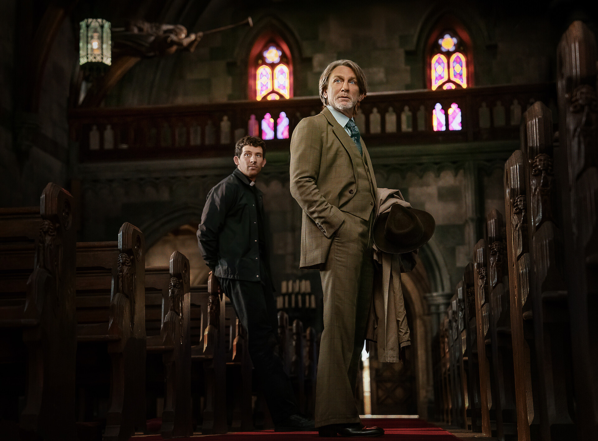 Wake Up Dead Man: A Knives Out Mystery - Daniel Craig and a priest in a church. 