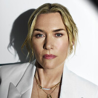Kate Winslet with a spotlight on her face.