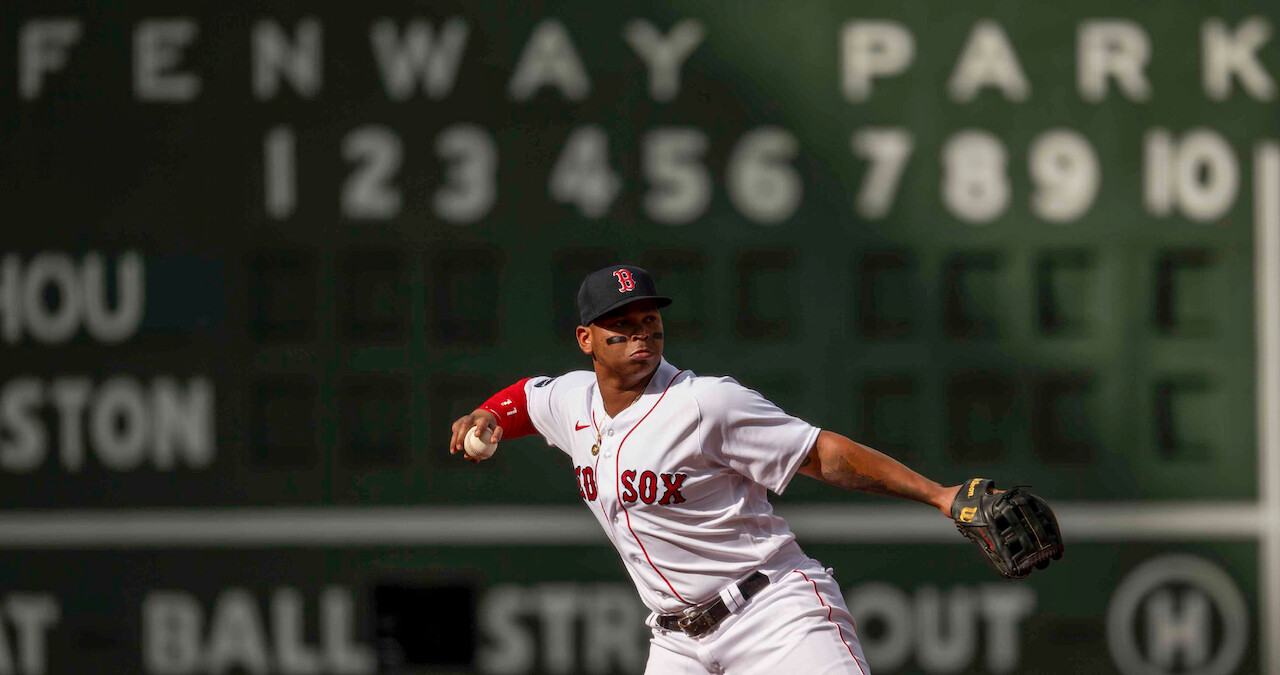 Rafael Devers of the Boston Red Sox throws during the first inning of a game against the Houston Astros at Fenway Park in Boston.