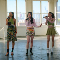 Members of KATSEYE singing.