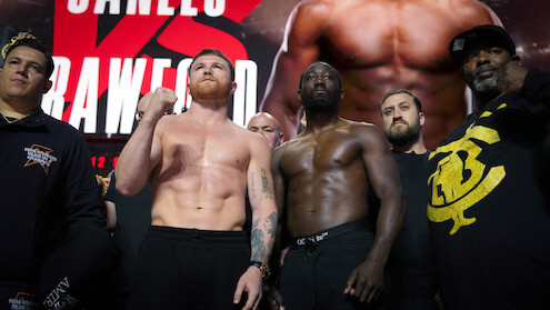 Undisputed super middleweight champion Canelo Alvarez faces off against Terence Crawford during a weigh-in.