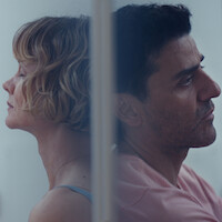 A man and a woman facing away from each other