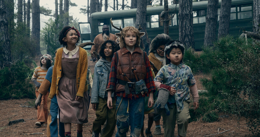 Nonso Anozie as Jepperd and the hybrid children in Sweet Tooth.