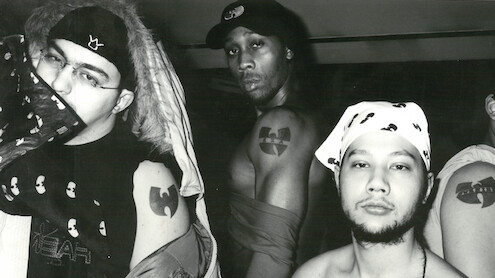 A black and white photograph featuring (L to R) Tarik Azzougarh, The RZA and Jeremy Waterloo showing off their Wu-tang Clan tattoos as featured in The Disciple. Photo by Tarik Azzougarh