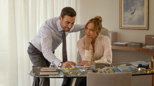 Jennifer Lopez as Jackie Cruz and Brett Goldstein as Daniel Blanchflower in 'Office Romance'