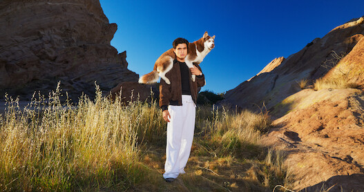 Charles Melton poses.