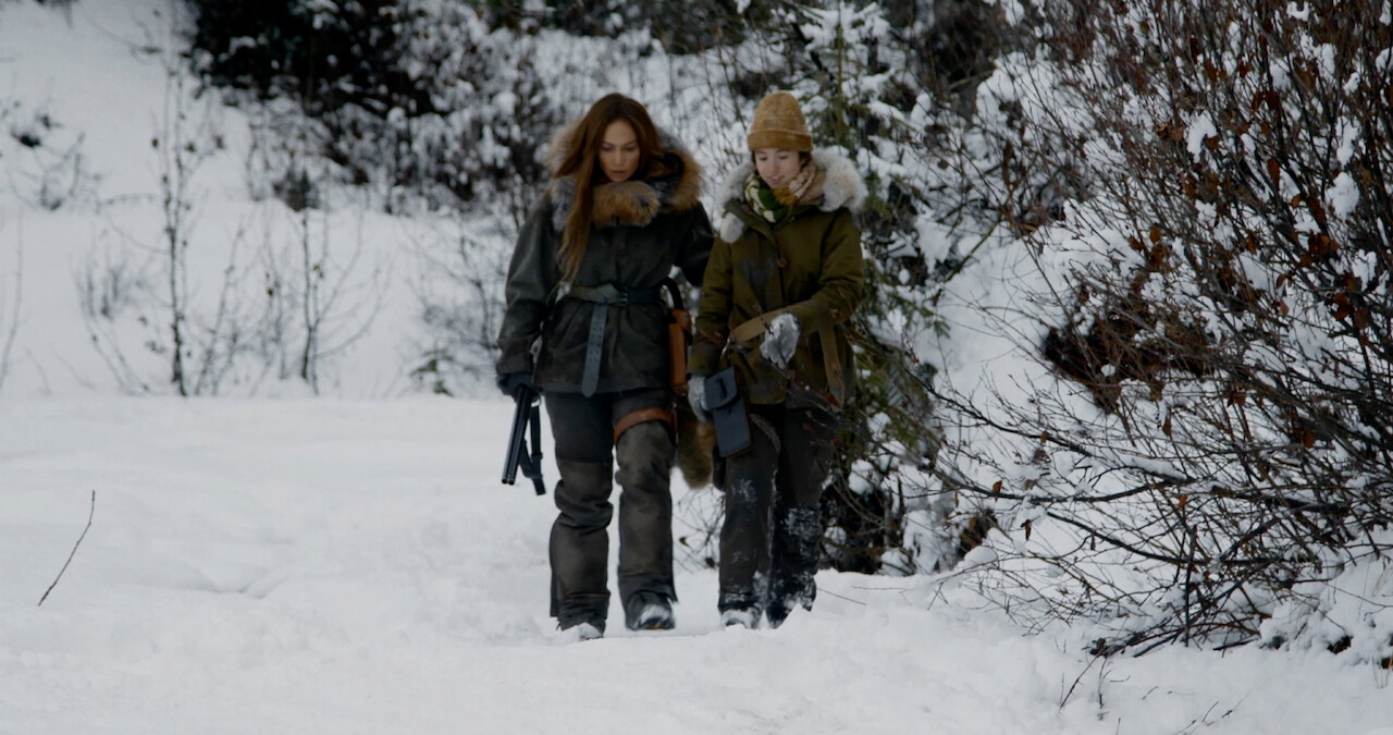Jennifer Lopez and Lucy Paez walking in snow