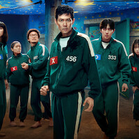 'Squid Game' Season 3 players in green tracksuits with numbers.