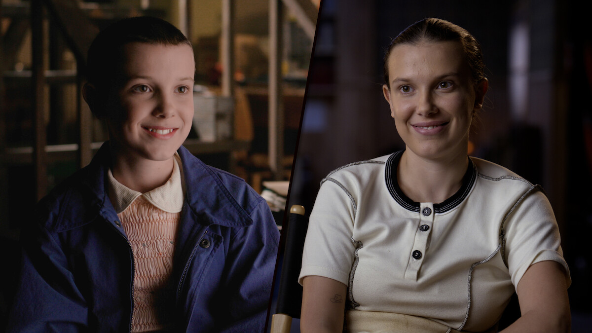 A split-screen contrasts Millie Bobby Brown in Season 1, with short hair and a blue jacket, smiling in a brightly lit room, and her Season 5 look, wearing a white shirt and smiling softly in a dimly lit indoor setting.