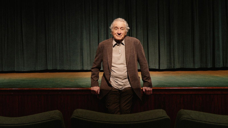  Robert De Niro leans on a stage