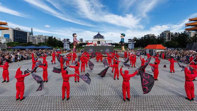 Pink Guards wave flags at a 'Squid Game' Season 3 fan event in Taipei, Taiwan.