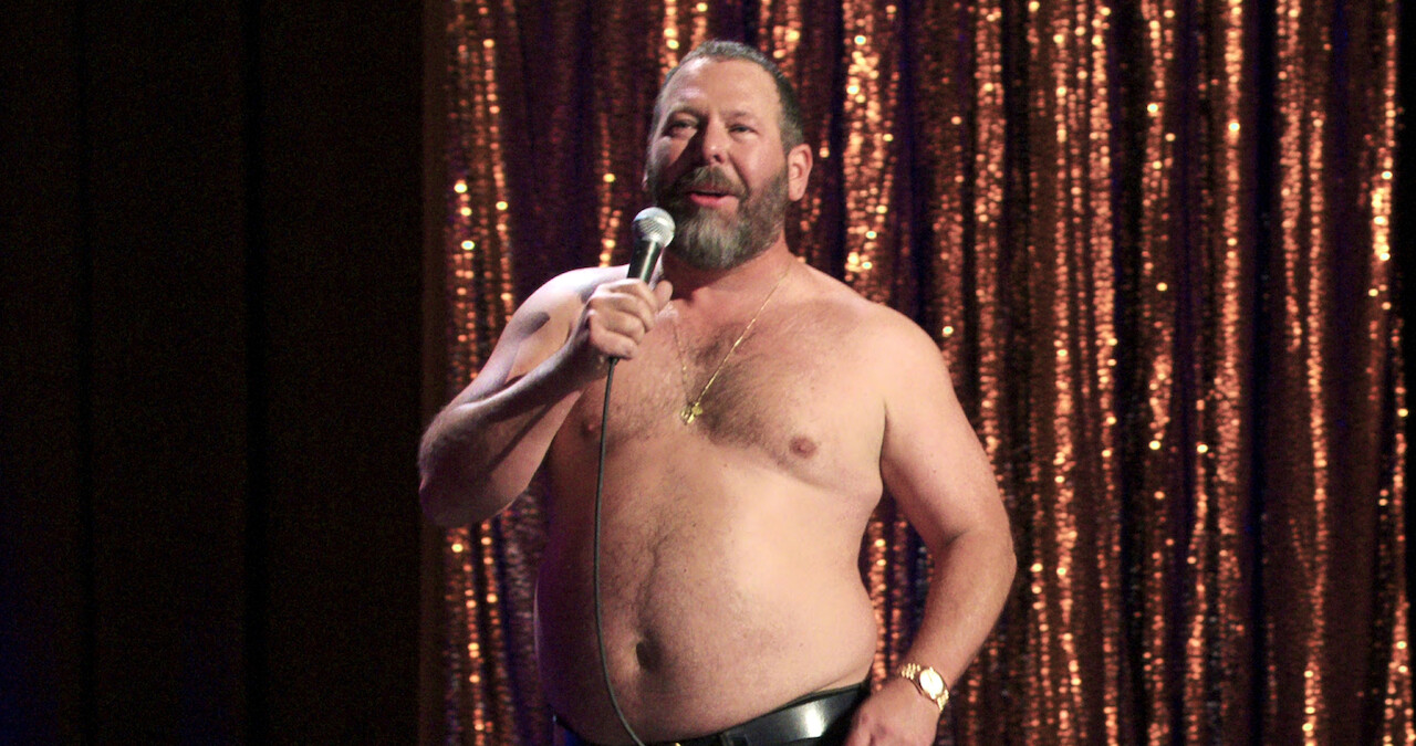 Comedian Bert Kreischer onstage with his shirt off