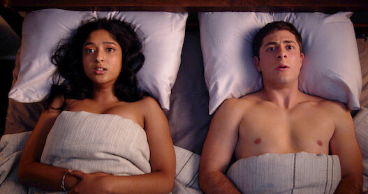Ben and Devi sitting bed staring at the ceiling 