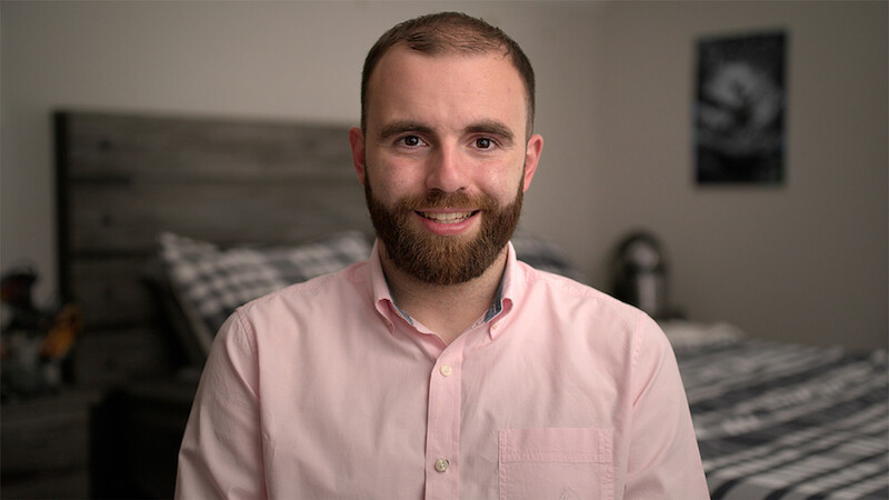 Connor sits in his bedroom.