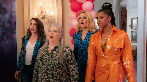 Busy Philipps as Summer, Paula Pell as Gloria, Renee Elise Goldsberry as Wickie, and Sara Bareilles as Dawn enter a room with their mouths open in shock in Season 3 of 'Girls5eva'