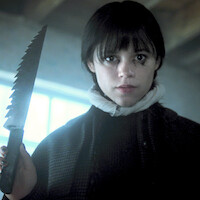 Jenna Ortega as Wednesday Addams holds a large knife in 'Wednesday' Season 2