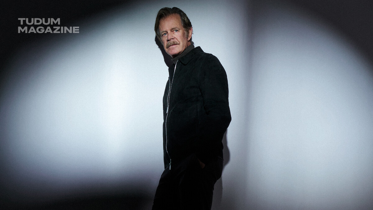 William H. Macy poses in front of a white background.
