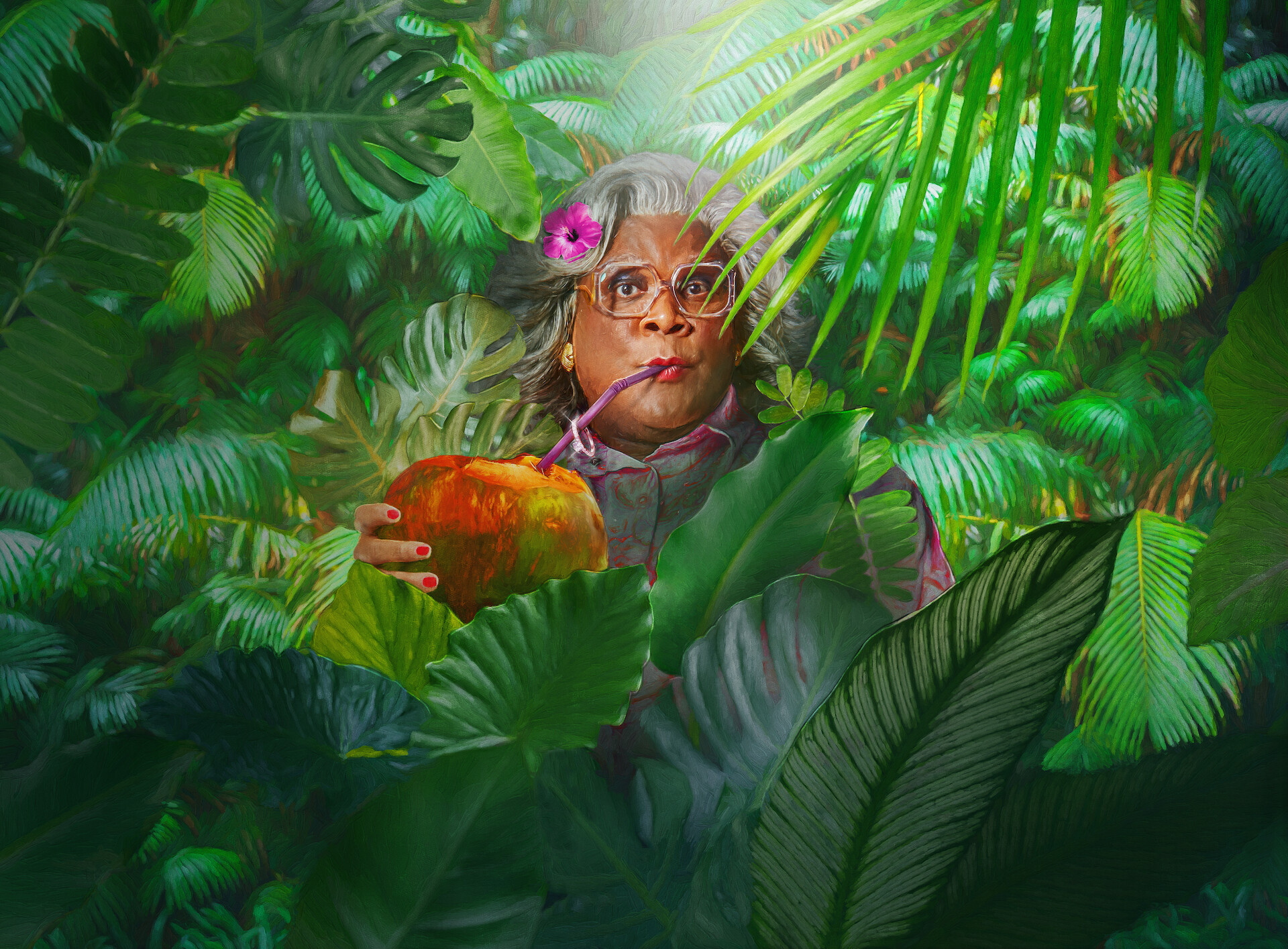 Madea’s Destination Wedding - Madea drinking out of a coconut surrounded by ferns