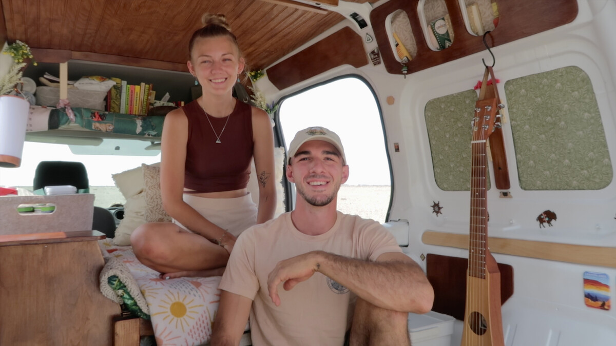 Gabby and Brian smiling inside their van