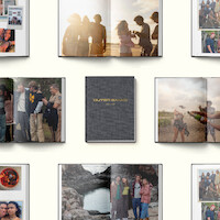 Photo books open to pages showing groups of friends celebrating outdoors, laughing, and standing near water, centered around a closed book titled OUTER BANKS 2020-2024 on a light background.