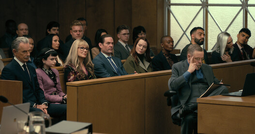 The Usher family seated in a court room.