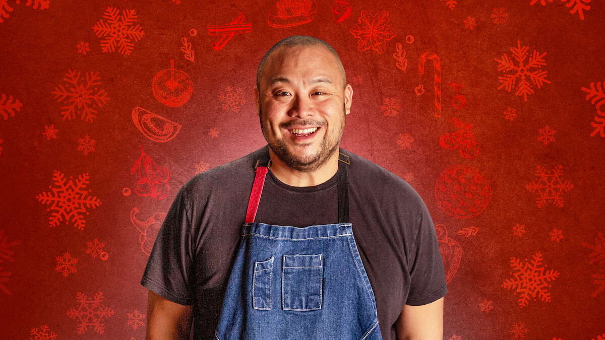 David Chang in a blue apron