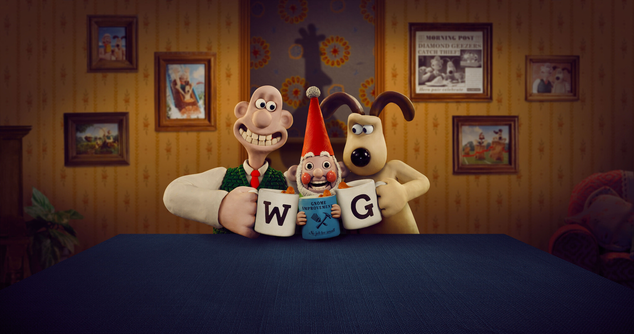 Wallace & Gromit clicking mugs with their initials with a gnome